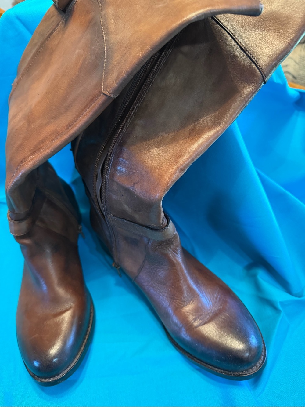 Women’s Brown Leather knee high Boots. A side zipper helps for easy on and off.